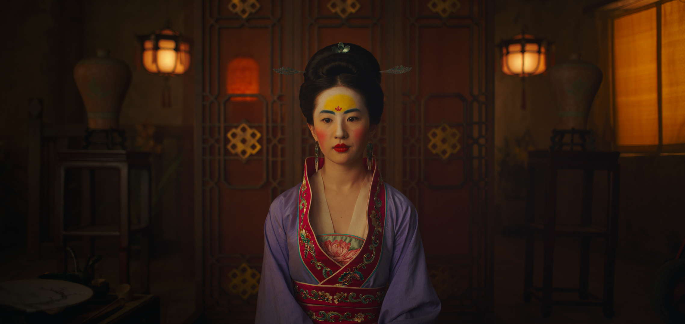 Mulan, a young maiden, all dolled up -- to be presented to a matchmaker, to discover if she's worthy of a "good" husband