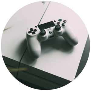 A white PS4 console with a white DualShock 4 wireless controller