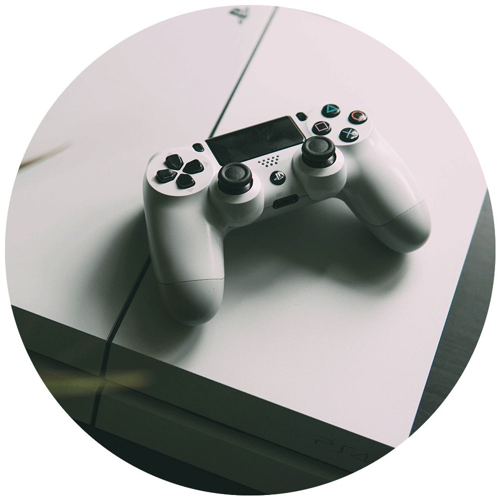 A white PS4 console with a white DualShock 4 wireless controller