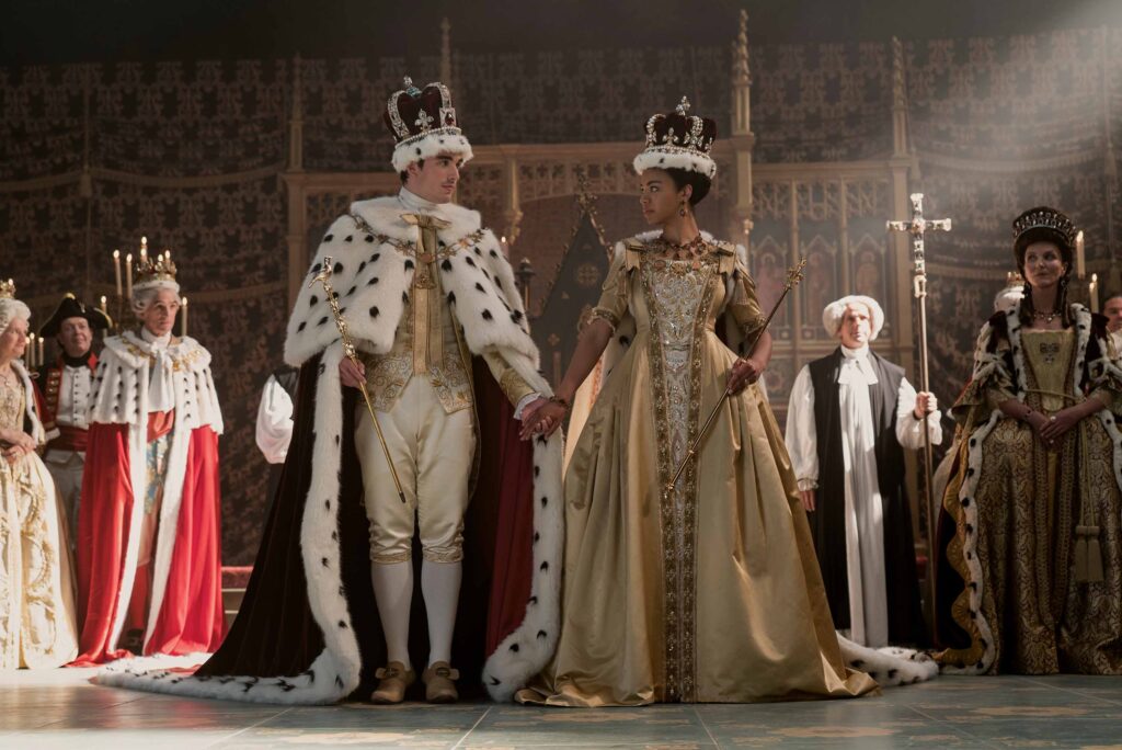 Corey Mylchreest as King George, India Amarteifio as Queen Charlotte, Michelle Fairley as Princess Augusta in Queen Charlotte: A Bridgerton Story episode 3