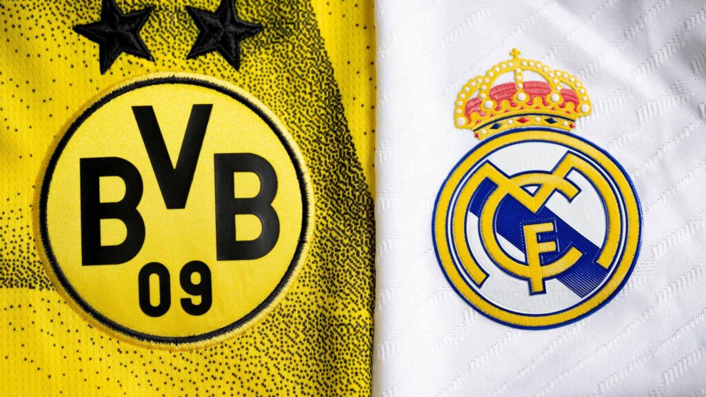Borrusia Dortmund and Real Madrid jerseys placed side by side, with the logos in close-up