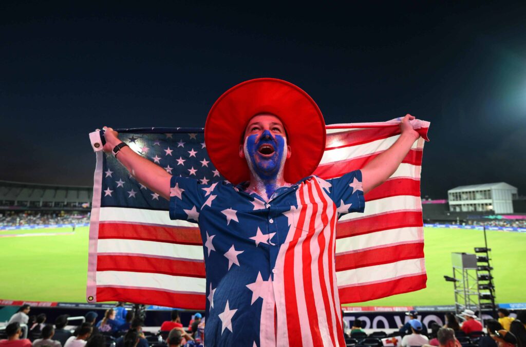 USA fan holding flag at opening match of T20 World Cup 2024 in Dallas, Texas